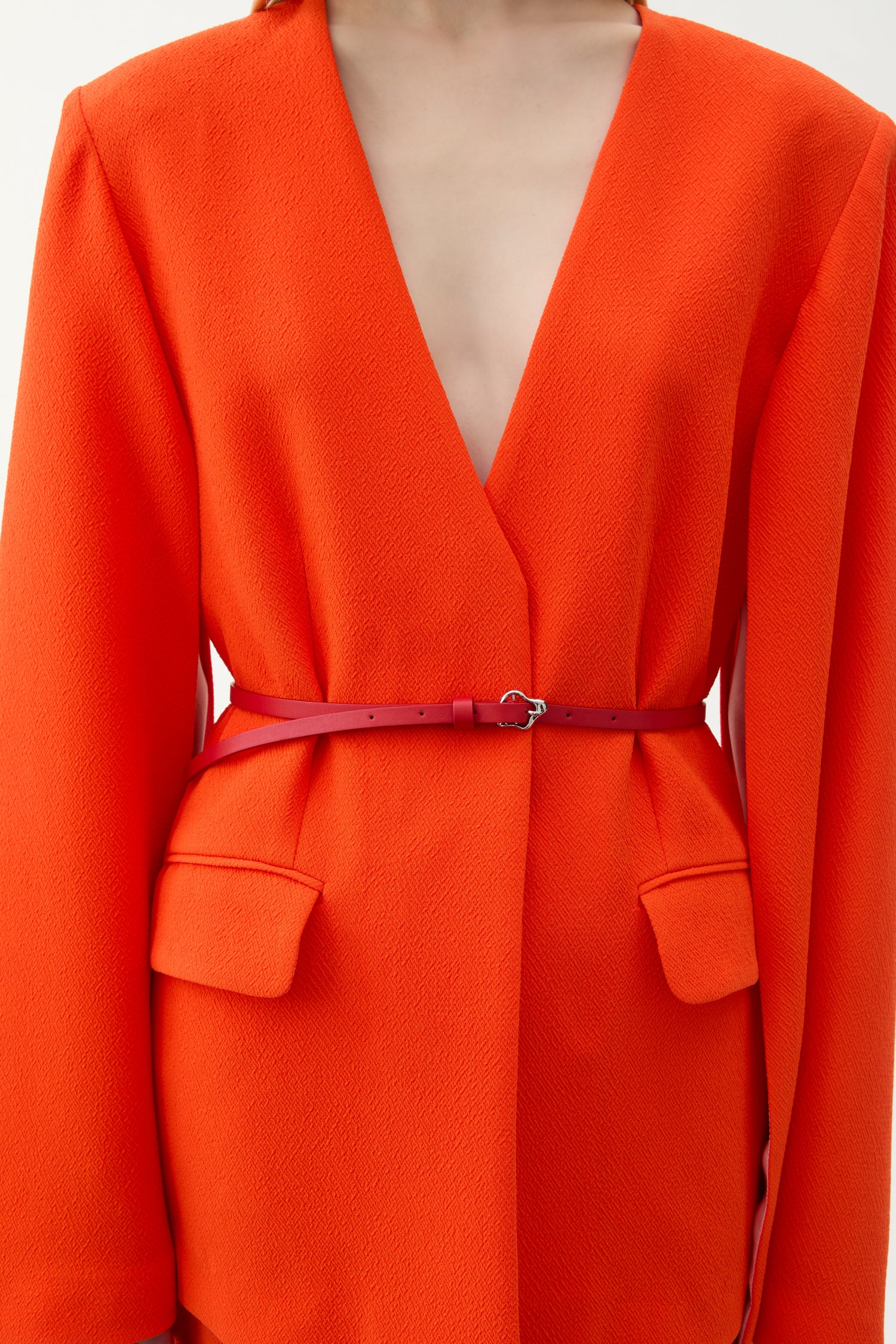 Small coral leather belt